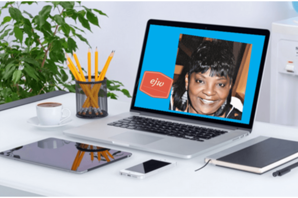 Home workspace with laptop, notebook, and desk accessories